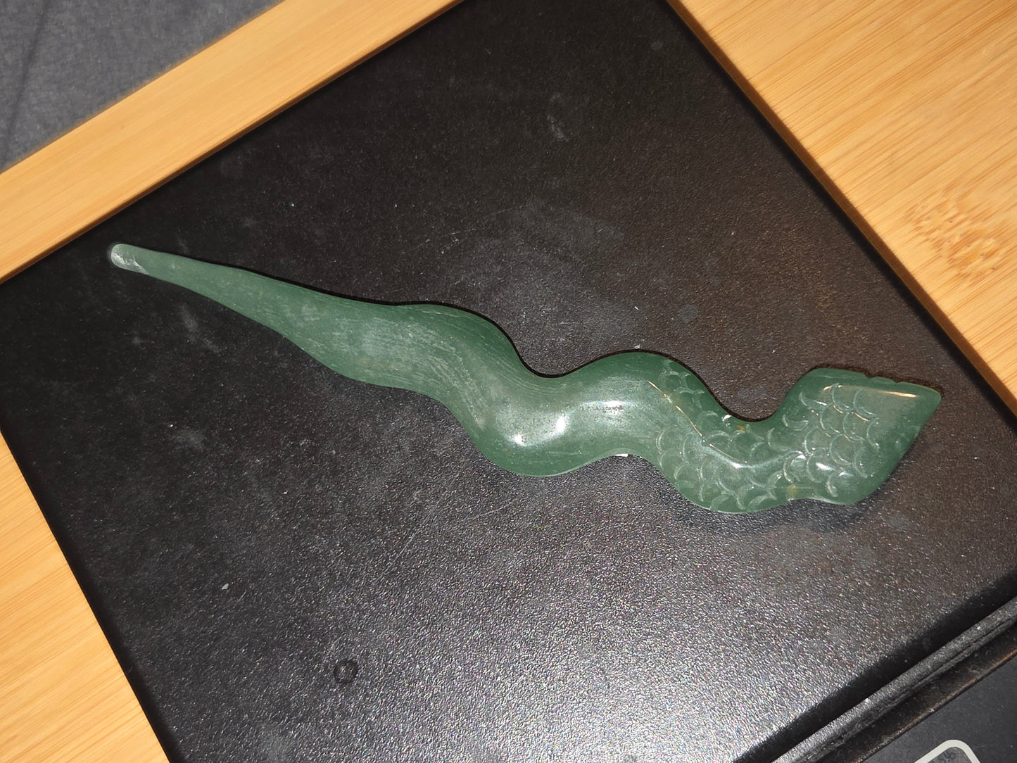 Green aventurine snake carving