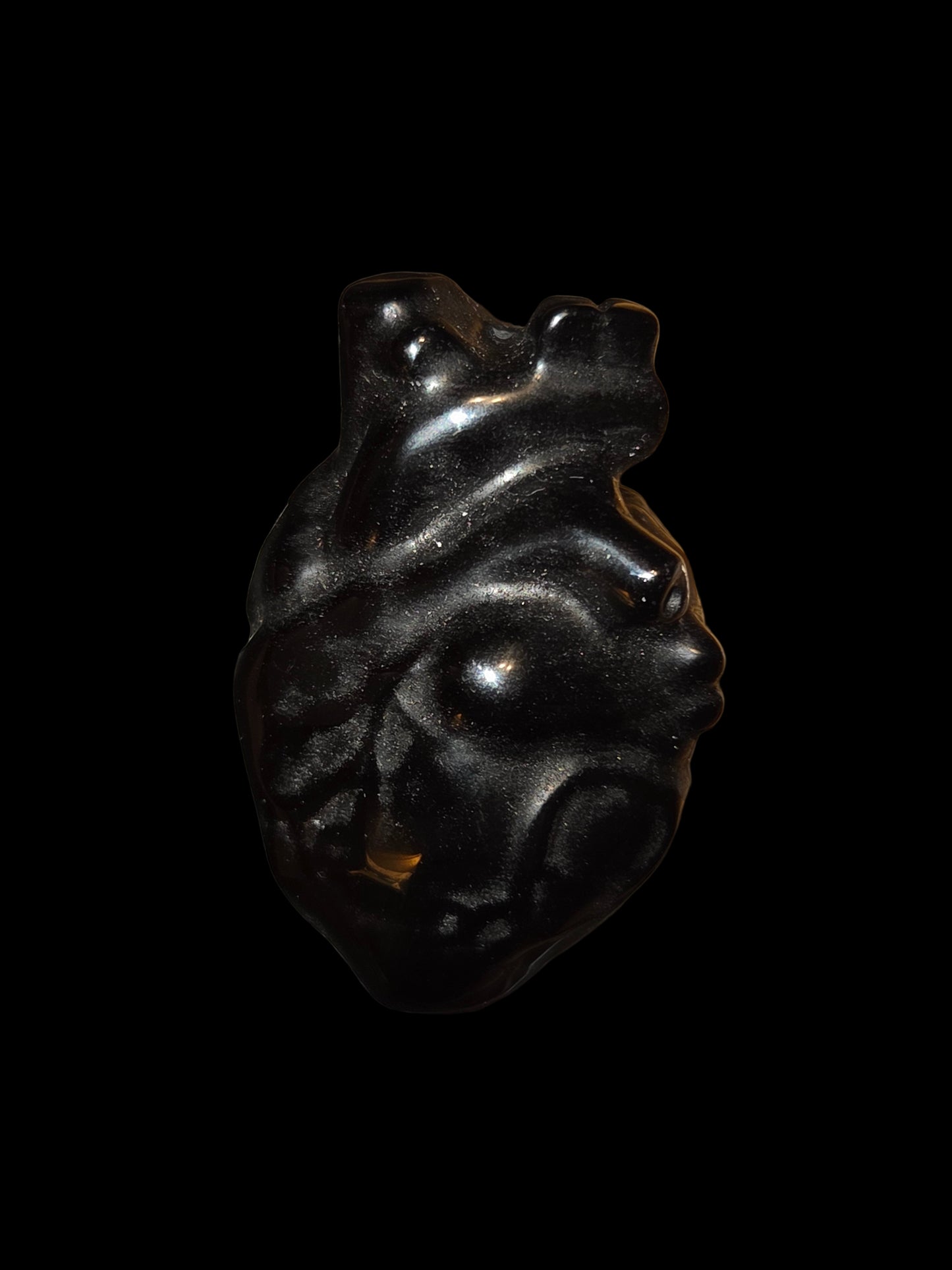 Obsidian human heart carving