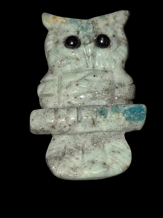 Granite with pyrite owl carving