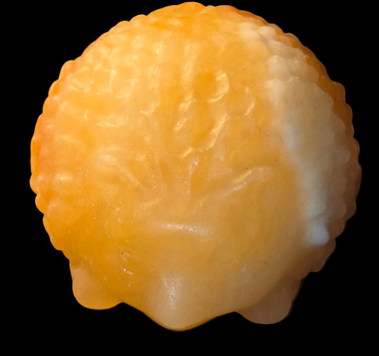 Honey calcite hedgehog carving
