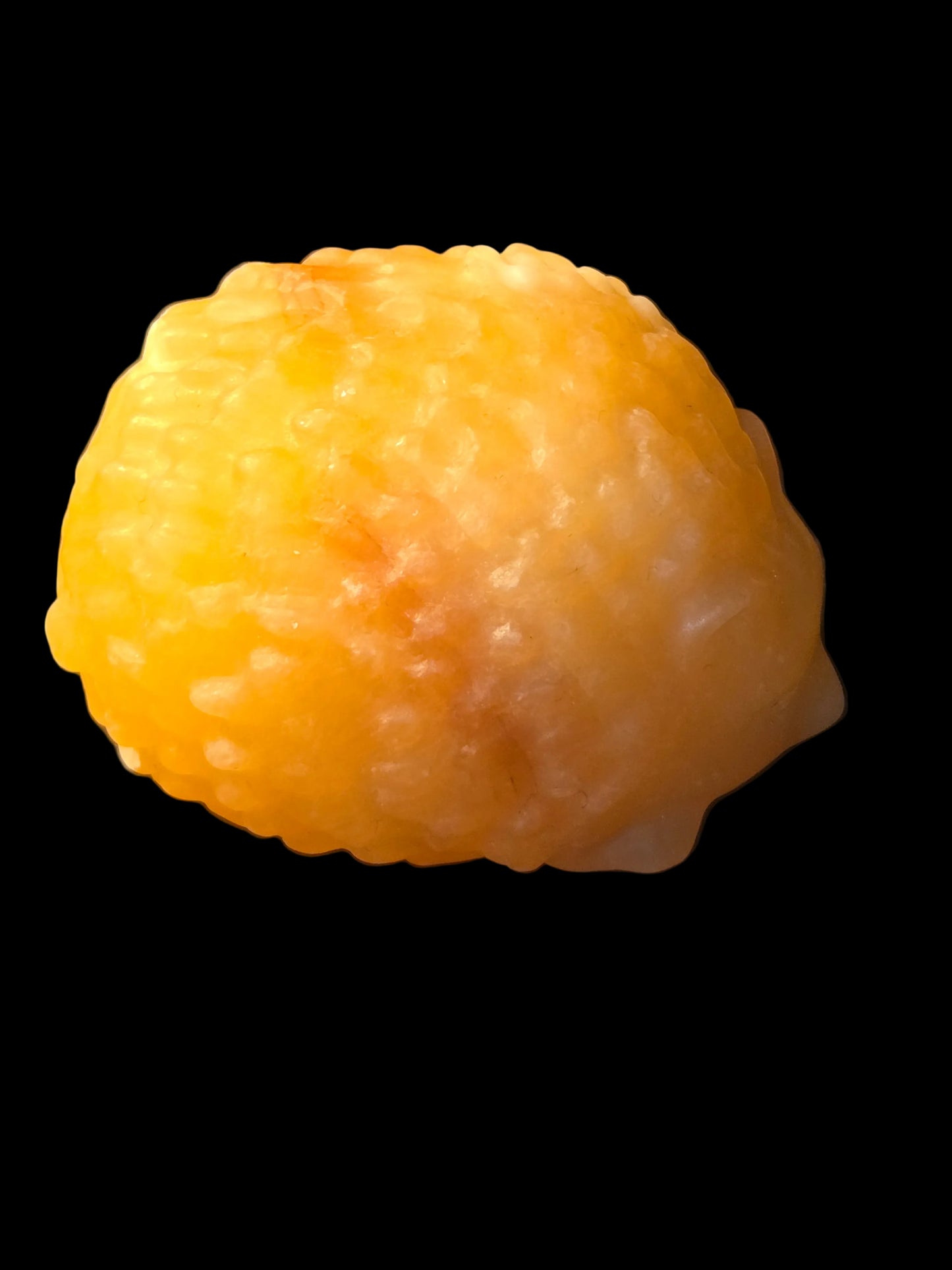Honey calcite hedgehog carving